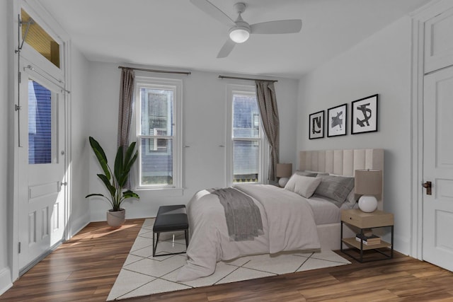 bedroom with hardwood / wood-style flooring and ceiling fan