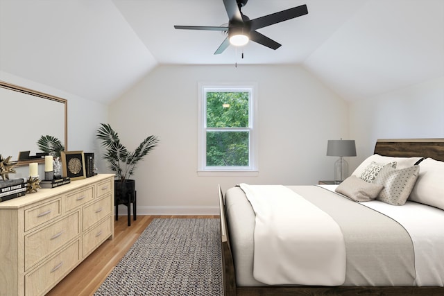 bedroom with lofted ceiling, ceiling fan, and light hardwood / wood-style flooring