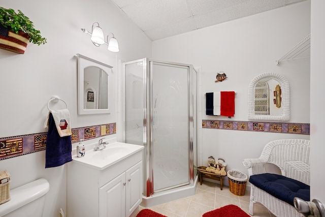 bathroom featuring vanity, tile patterned flooring, an enclosed shower, and toilet