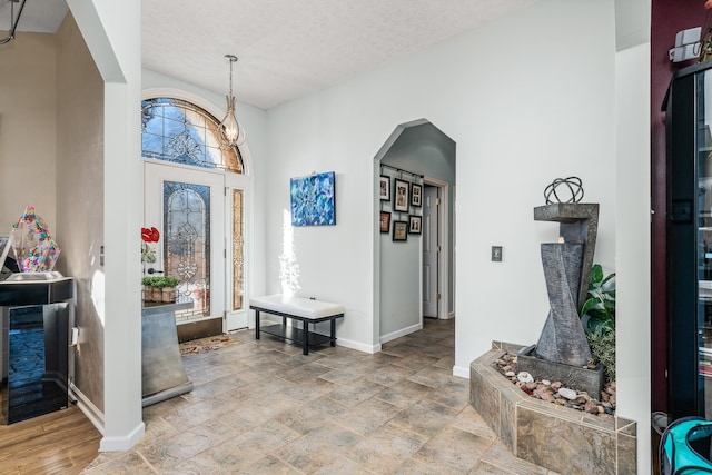 entryway featuring a textured ceiling