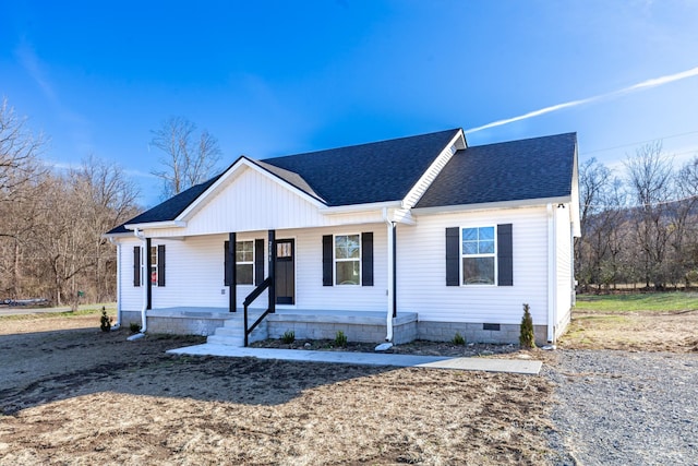 view of front of property with crawl space, a shingled roof, and a porch