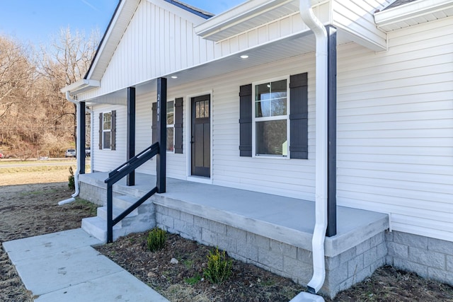 doorway to property featuring covered porch