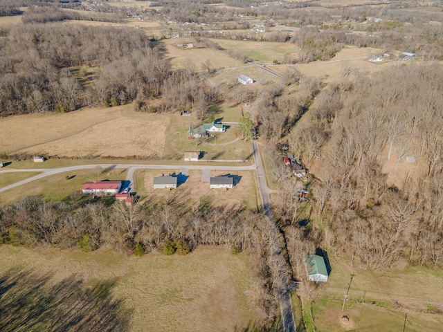 birds eye view of property with a rural view