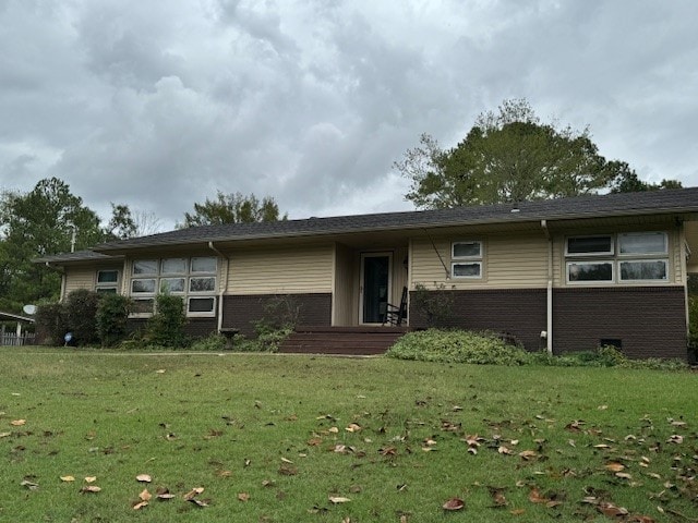 ranch-style house with a front yard