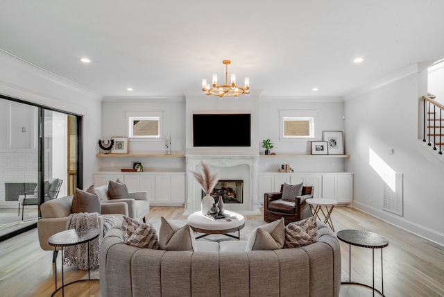 living room featuring a fireplace, light wood-type flooring, and a healthy amount of sunlight