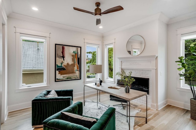 office featuring ornamental molding, a wealth of natural light, and light hardwood / wood-style floors