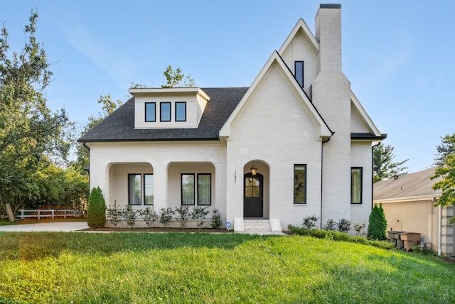 view of front of property with a front lawn