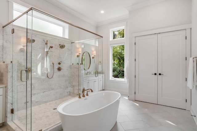 bathroom with independent shower and bath, vanity, and crown molding