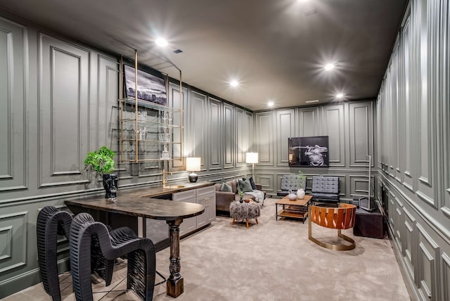 living area with light colored carpet