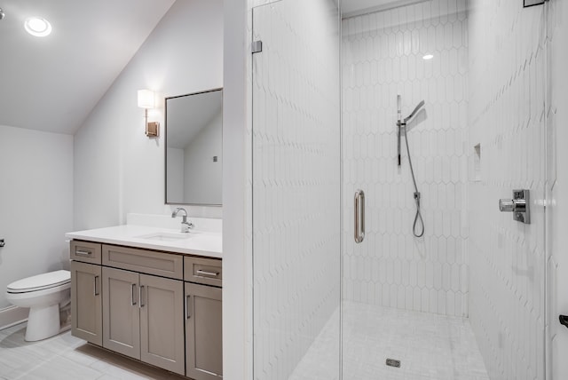 bathroom with walk in shower, vanity, toilet, and vaulted ceiling