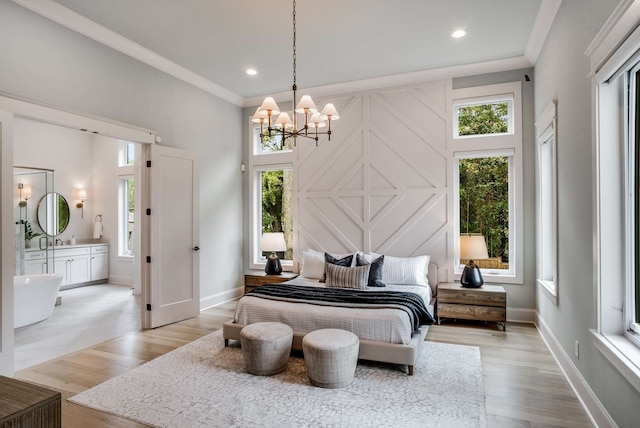 bedroom with ornamental molding, light wood-type flooring, and a chandelier