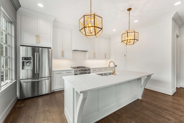 kitchen featuring dark hardwood / wood-style floors, sink, white cabinetry, stainless steel appliances, and decorative light fixtures