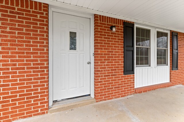 doorway to property with covered porch