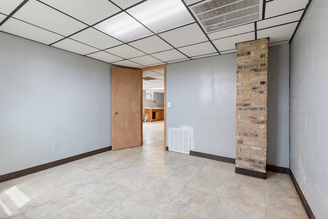 empty room with a paneled ceiling