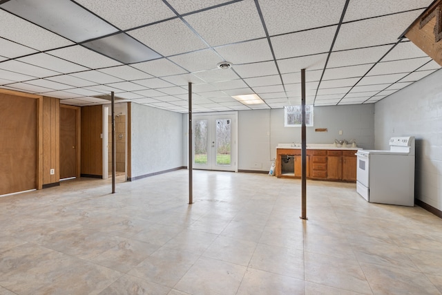 basement with a paneled ceiling