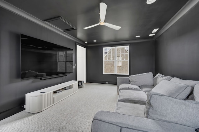 home theater room with carpet floors and crown molding