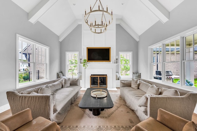 living room with wood-type flooring, an inviting chandelier, beam ceiling, and high vaulted ceiling