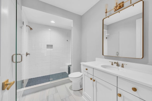 bathroom featuring walk in shower, vanity, and toilet