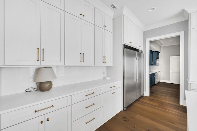 kitchen featuring dark hardwood / wood-style floors, ornamental molding, high end refrigerator, and white cabinetry