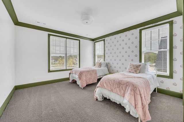 bedroom featuring carpet flooring and ornamental molding