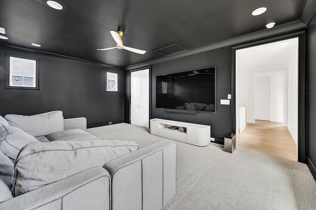 living room with ceiling fan, light hardwood / wood-style flooring, crown molding, and a wealth of natural light