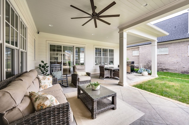 view of patio / terrace with an outdoor living space, ceiling fan, and area for grilling