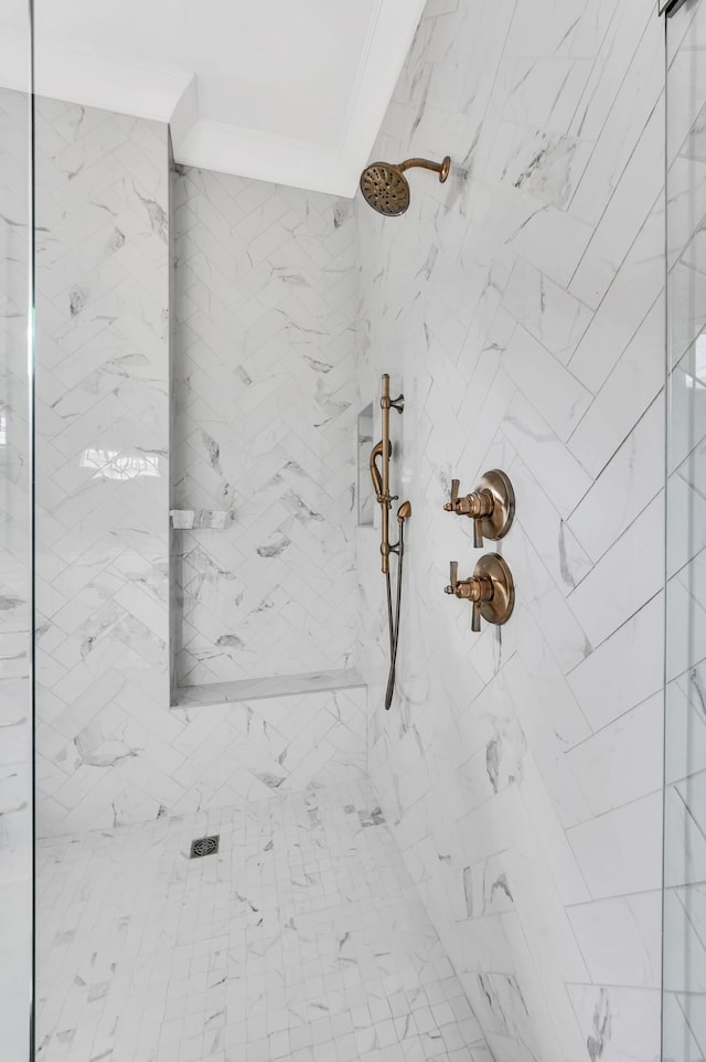 details featuring crown molding and a tile shower