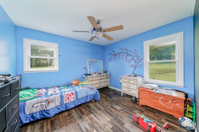 bedroom featuring dark hardwood / wood-style flooring and ceiling fan