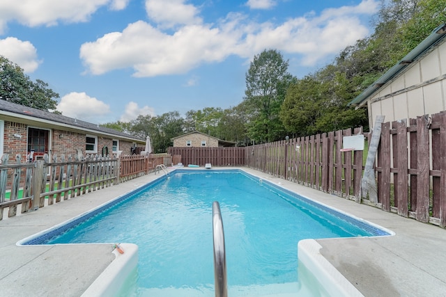 view of swimming pool featuring a patio