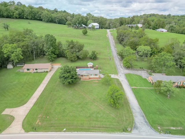 birds eye view of property with a rural view