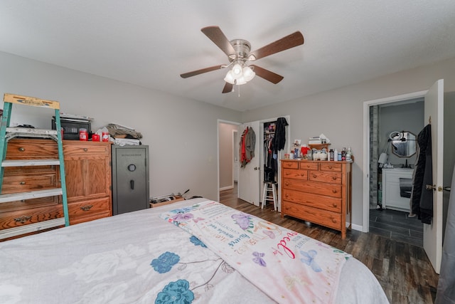 bedroom with dark hardwood / wood-style floors, ceiling fan, and ensuite bath