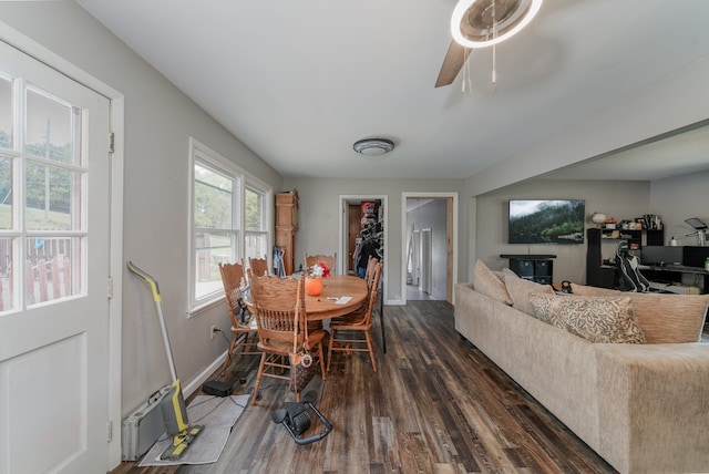 dining space featuring ceiling fan and dark wood-type flooring