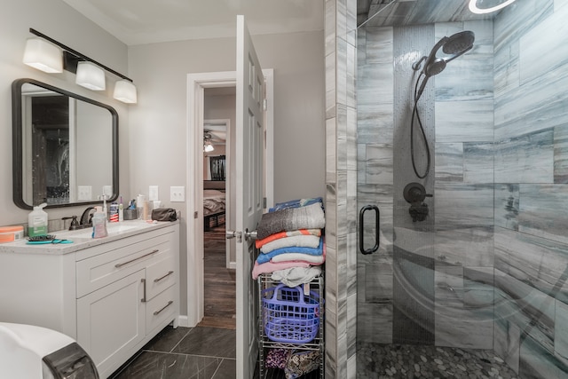 bathroom with vanity, hardwood / wood-style floors, and a shower with door