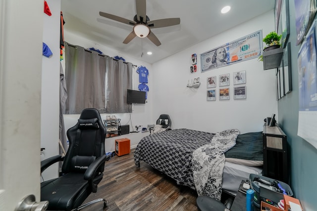 bedroom featuring dark hardwood / wood-style flooring and ceiling fan