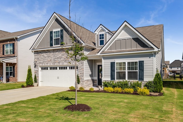 craftsman-style house featuring a front yard and a garage