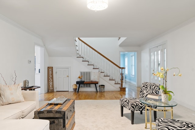 living room featuring hardwood / wood-style floors and ornamental molding