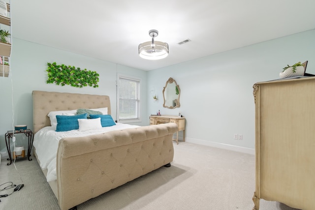 bedroom with light colored carpet