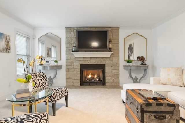 carpeted living room with a stone fireplace and crown molding