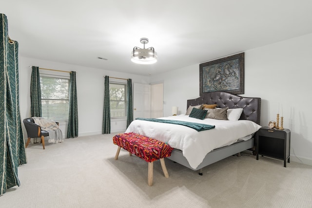 bedroom with light colored carpet