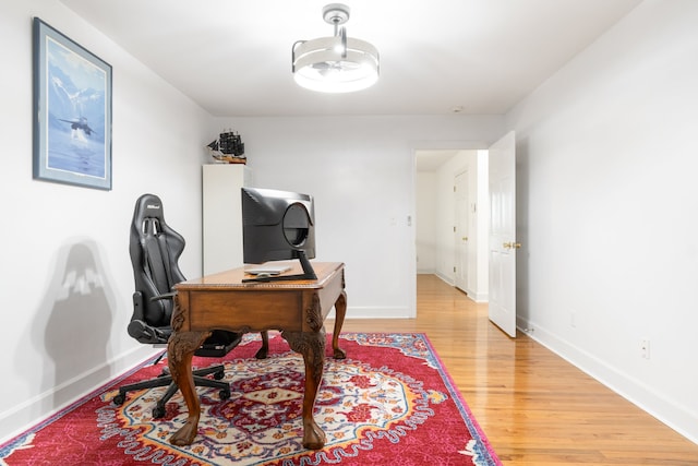 office space with light hardwood / wood-style floors