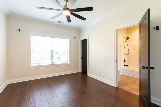 unfurnished room featuring ceiling fan, crown molding, and dark hardwood / wood-style flooring