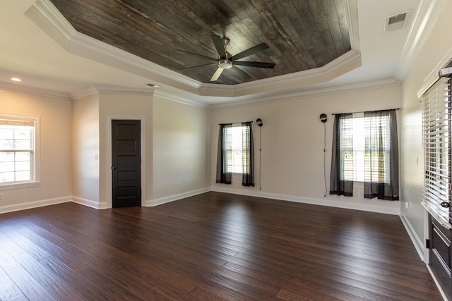 unfurnished room featuring ornamental molding, dark hardwood / wood-style flooring, and a wealth of natural light