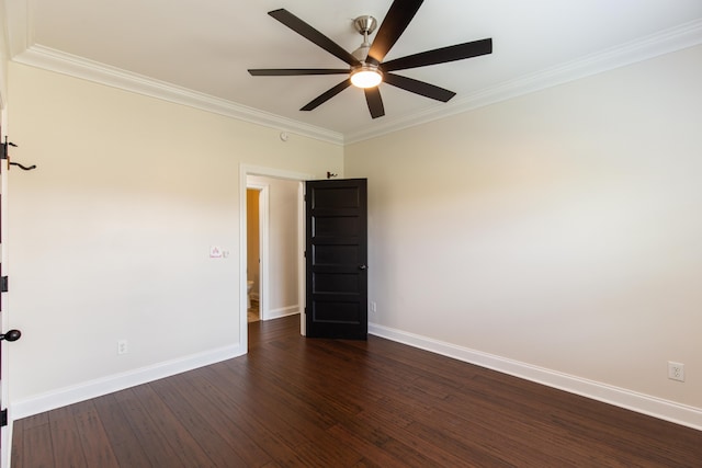 empty room featuring ceiling fan, crown molding, and dark hardwood / wood-style flooring