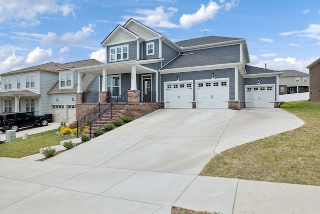 craftsman inspired home with a front lawn and covered porch