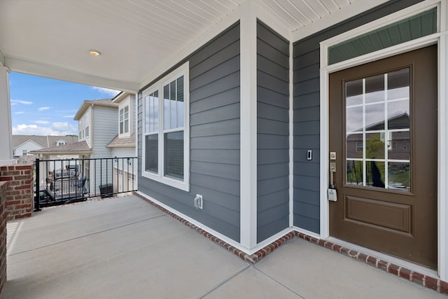 property entrance with covered porch