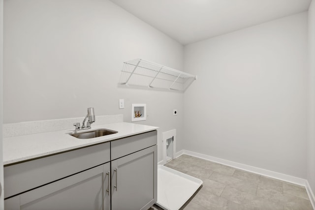 washroom featuring washer hookup, light tile patterned floors, electric dryer hookup, cabinets, and sink