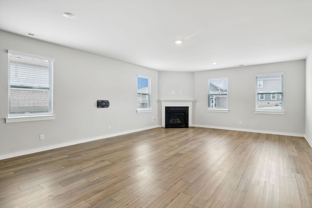 unfurnished living room with light hardwood / wood-style floors