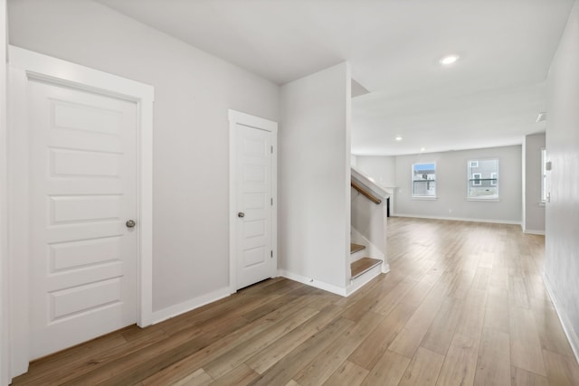 unfurnished living room with light hardwood / wood-style flooring