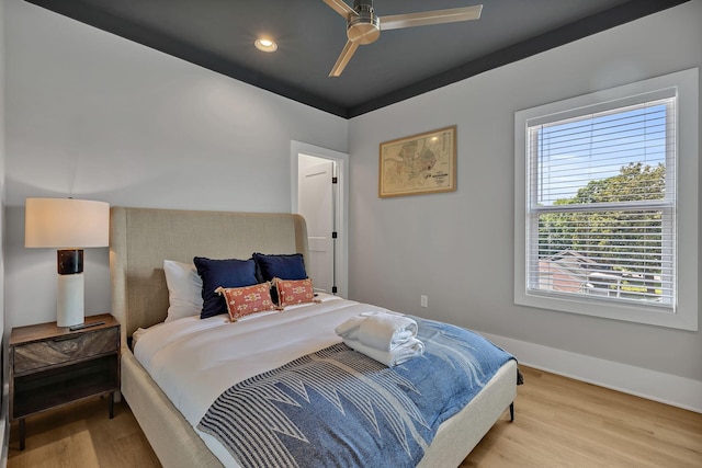 bedroom featuring recessed lighting, wood finished floors, a ceiling fan, and baseboards