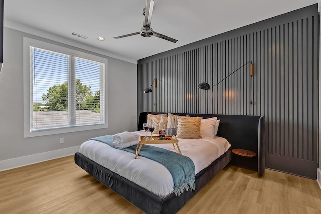 bedroom featuring light wood-type flooring, baseboards, visible vents, recessed lighting, and a ceiling fan